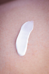 texture of cream. SPF cream. Girl applying cream on the beach. moisturizer. close-up. smear