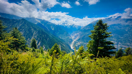 mountains green valley with blue sky and clouds