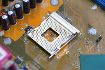 Blank CPU socket on mainboard background.