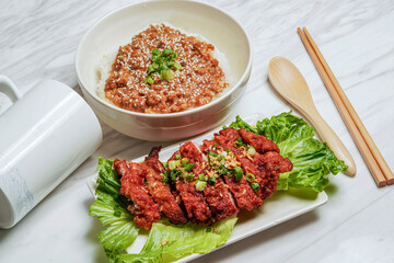 Big chunks of julang pork chop with minced pork rice served in dish isolated on marble background side view of taiwan food