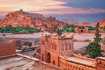 Ait-Benhaddou, Morocco. Medieval clay fortified city in North Africa, Atlas Mountain range in the background.