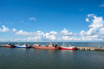 Fishing boats moored to a quay or jetty at Heltermaa harbour on the Baltic Sea, Estonia