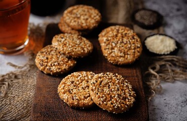 Sunflower seeds, sesame seeds cookies on a dark background