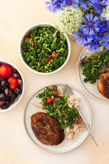 Enjoy a hearty meal with turkey paired with gluten-free pasta and a fresh salad of seasonal vegetables and herbs, complemented by ripe fruits for a balanced and nutritious breakfast or lunch