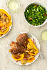 Enjoy a hearty breakfast or lunch with baked turkey served alongside roasted zucchini, sweet peppers, and onions, complemented by a fresh salad of seasonal vegetables and herbs