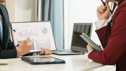Business people in the conference room are introducing and consulting each other to create good...