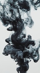 Black ink swirling in water against a