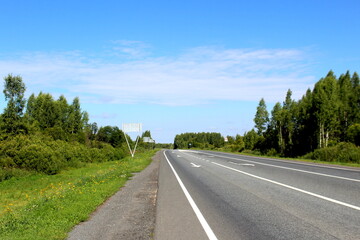 Asphalt road on a clear sunny summer day.