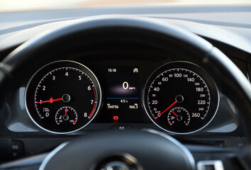 Dashboard view of a car display showing speed and temperature details
