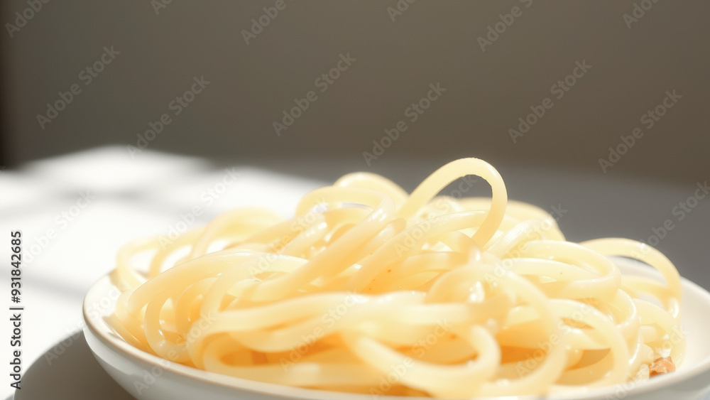 Wall mural Close up of cooked spaghetti in a white bowl