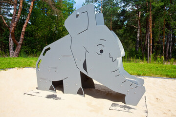 Plac zabaw dla dzieci, zjeżdżalnia w kształcie słonia. Children's playground, elephant-shaped slide.