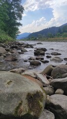 mountain river with stones and fast current