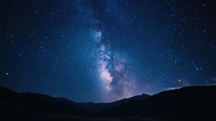 Fototapeta premium Milky Way Galaxy Over Silhouette of Mountains at Night