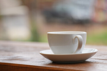 cup of coffee on wooden table