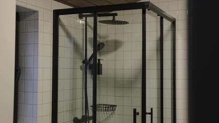 This modern glass shower enclosure adds a contemporary touch to any stylish bathroom setting
