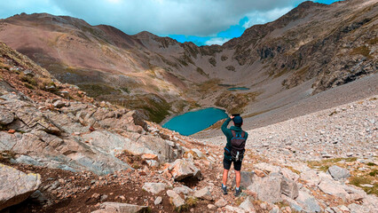 An adventurer travels through the valleys of the Eriste Peak, where the majestic peaks and the...