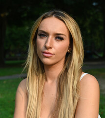 Naklejka premium beautiful young woman portrait outside