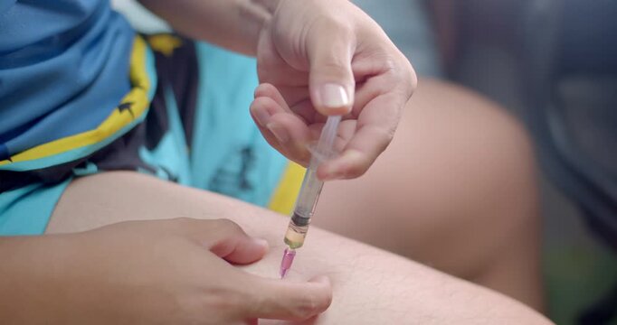 Inject Testosterone into the body.Increase Testosterone into the body through injections.Syringe with liquid being drawn into syringe.Testosterone.