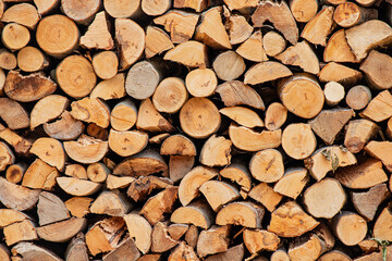 Organized stack of firewood, highlighting its role as a natural energy source and fuel