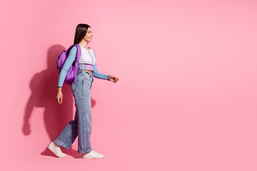 Photo of lovely adorable girl schoolgirl wear trendy clothes going school empty space isolated on pink color background