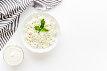 Bowl of farm cottage cheese, top view. Protein food