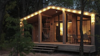 A Modern Cabin Retreat That Offers a Cozy Ambiance with Beautiful Outdoor Lighting Options