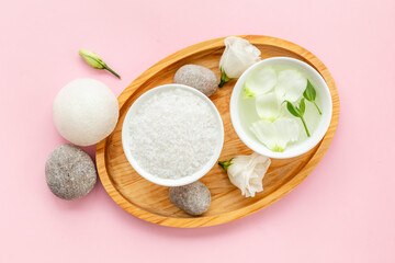 White cosmetics products with stones and white roses