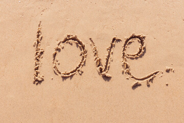 The inscription I love you on the seashore with palm trees