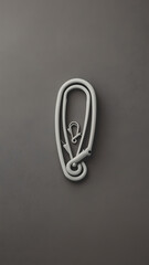 The image features two safety pins arranged in a minimalist style against a gray background