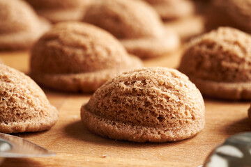 Freshly baked homemade Christmas cookies in the form of nuts, closeup