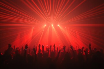 Electrifying concert scene with red stage lights illuminating a packed audience conveying the powerful energy and communal experience of live music events in a visually striking manner