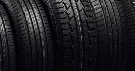 Closeup tires tread of car offroad and for highway on black background banner