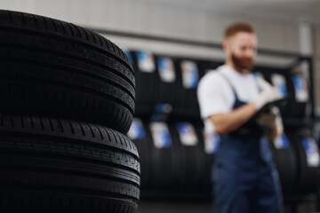Closeup new tyre, car tire store background