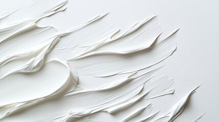 A close-up of textured, creamy white paint elegantly spread across a canvas, creating an abstract and modern aesthetic.