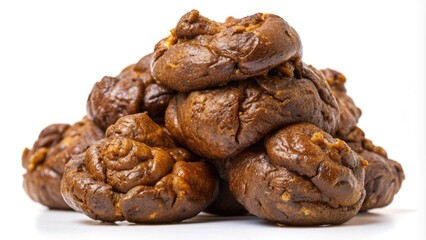 Obraz premium Close-up of brown feces with irregular shape and rough, lumpy texture, against a white background, showcasing the unpleasant and unappealing appearance of human waste.
