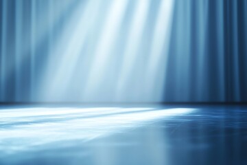 Calm and serene stage lighting effect with soft blue beams illuminating a reflective surface, perfect for artistic backgrounds.