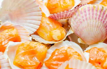A tray of shrimp is covered in shell cups
