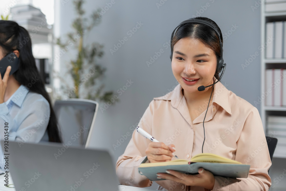 Aufkleber customer service agent is taking notes while talking with a customer on a headset