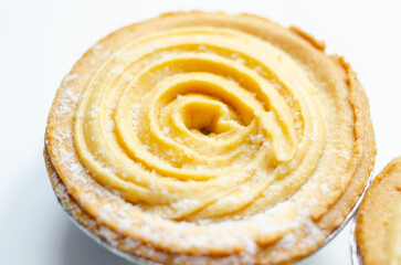 A pastry with a swirl of frosting on top