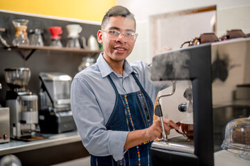 Portrait of a barista making coffee.