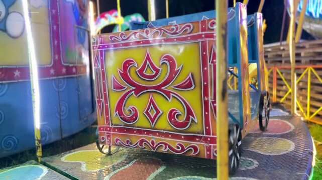 Cinematic Shoot Of carousels or "komedi putar" at night markets in Bireuen, Indonesia as a game for residents and children