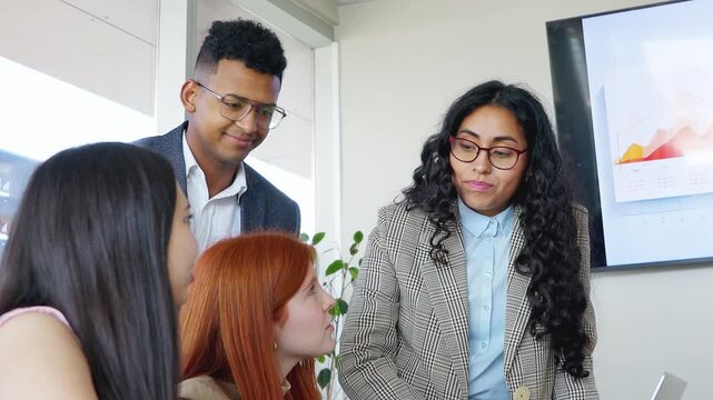 Young latin business teamwork focused collaborating on a project in meeting room office. Businesspeople co-working