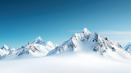 Obraz premium A serene winter landscape showcasing majestic snow-covered mountains under a clear blue sky, perfect for nature and travel themes.