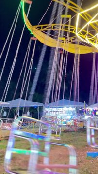 Cinematic Shoot Of carousels or "komedi putar" at night markets in Bireuen, Indonesia as a game for residents and children