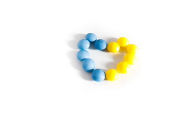 Blue and yellow heart in Ukraine or Sweden flag colors