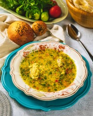 Chicken soup with vegetables being served for dinner