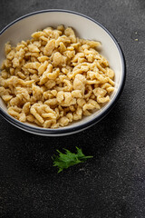 spaetzle egg pasta irregular shape fresh meal food snack on the table copy space food background rustic top view