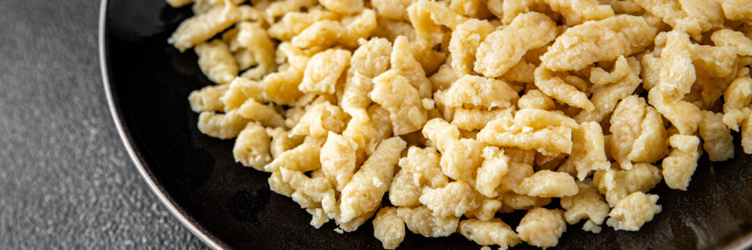 spaetzle egg pasta irregular shape fresh meal food snack on the table copy space food background rustic top view