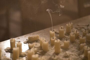 Last  of several candles snuffed out
