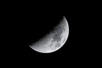 Detailed Gibbous Moon in the night sky. Crescent Moon on black sky
